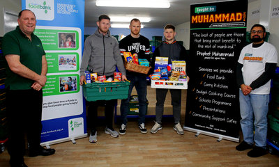 Dundee Foodbank Manager Ken Linton, together with Calum Butcher, Club Captain Mark Reynolds and Rizwan Rafik from Taught by Muhammad