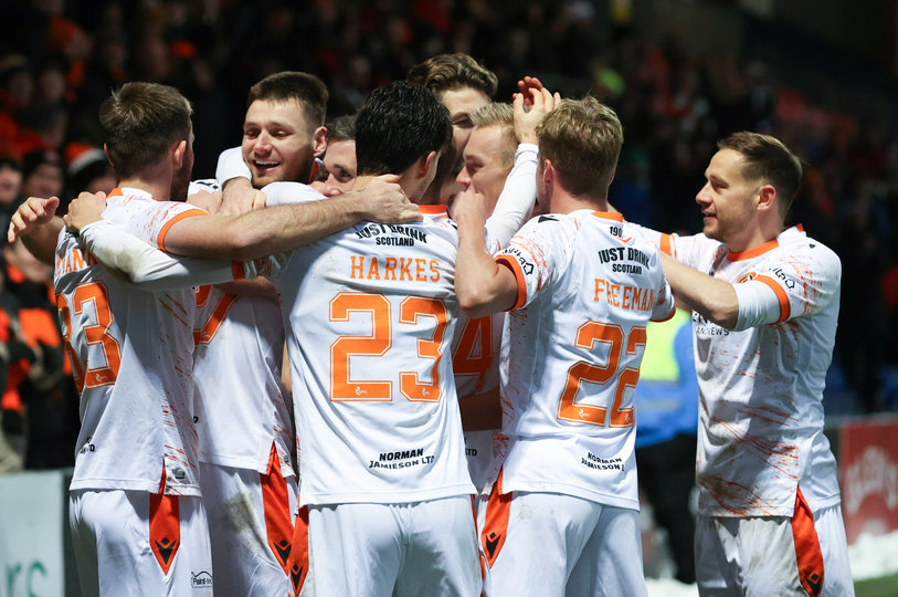 Dundee United players celebrate at Ross County